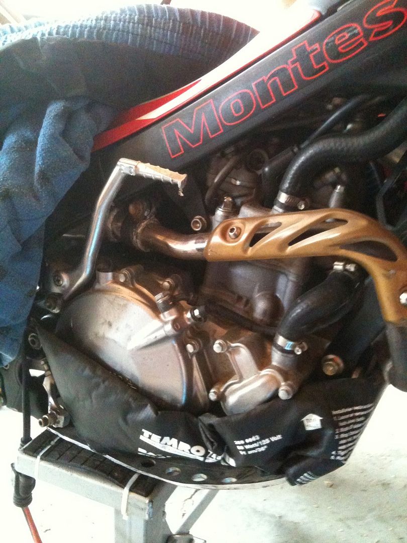 Motorcycle engine block heater for subfreezing temperatures