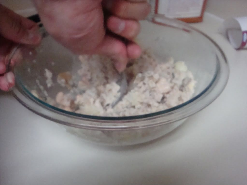 Mashing the potatoes and beans