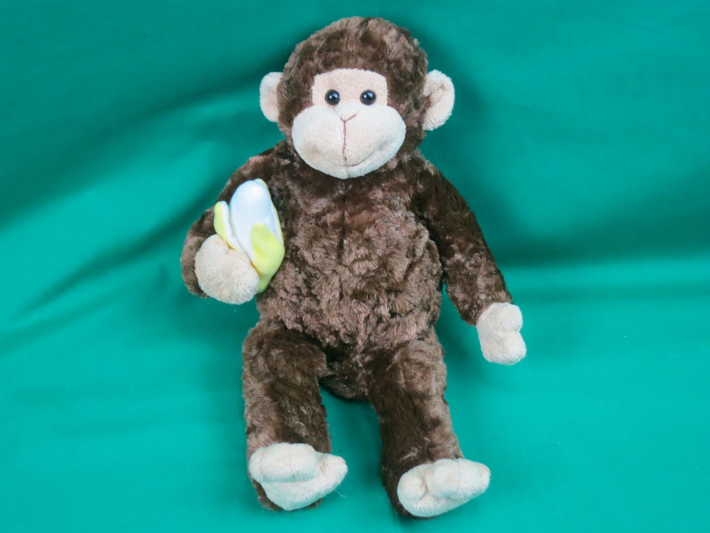 monkey holding banana stuffed animal