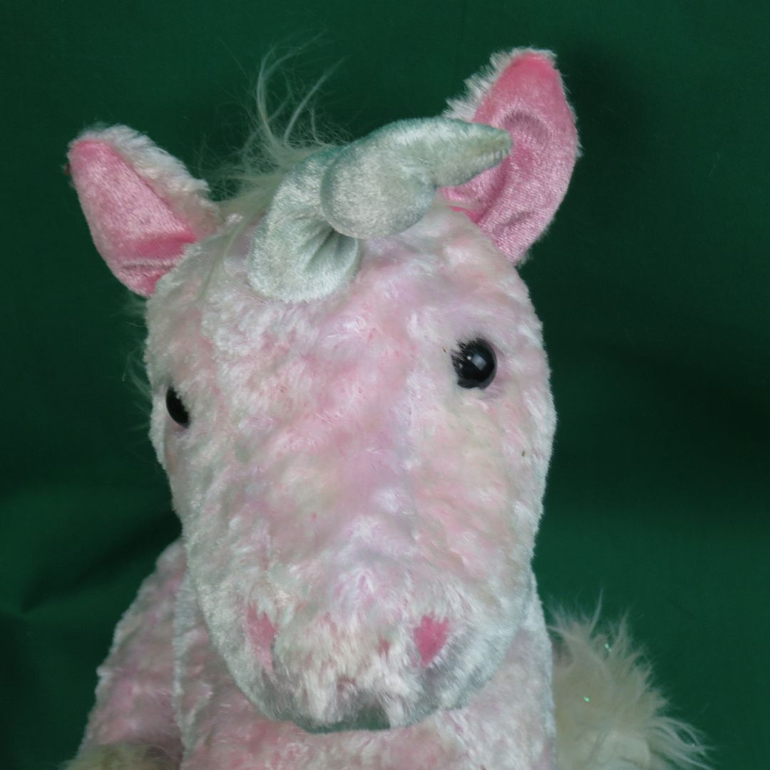 pink fluffy unicorn stuffed animal