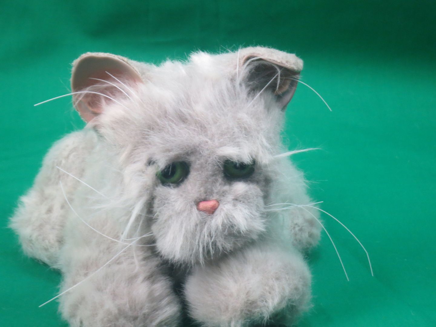 stuffed cat that meows and purrs