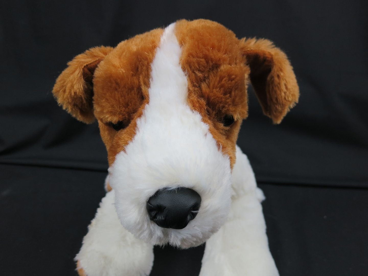 white and brown stuffed puppy