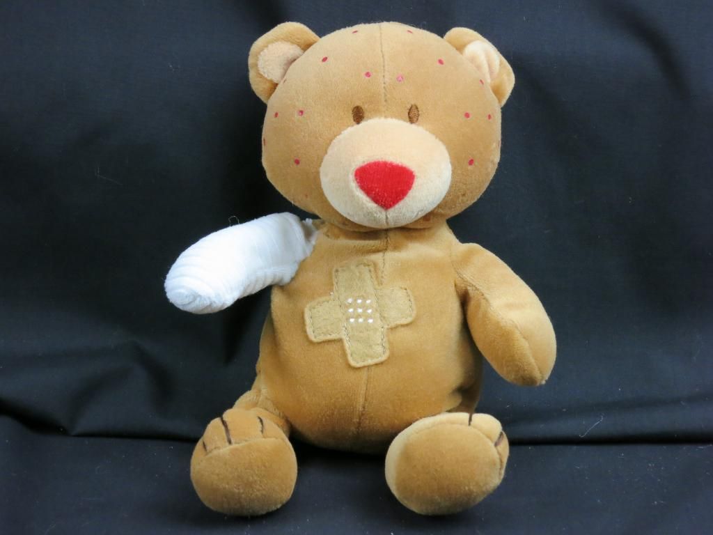 stuffed animal with broken arm