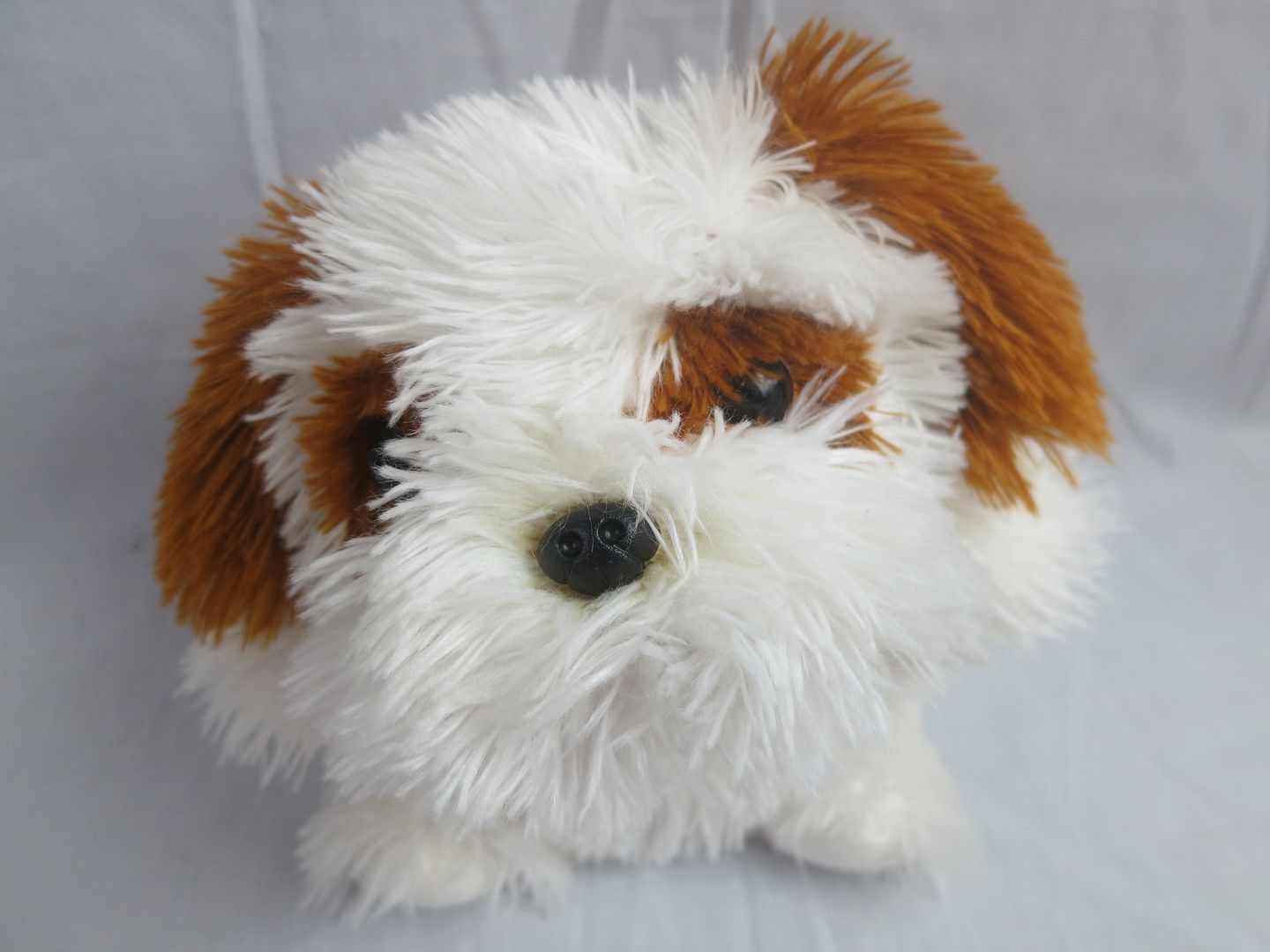 brown and white stuffed puppy