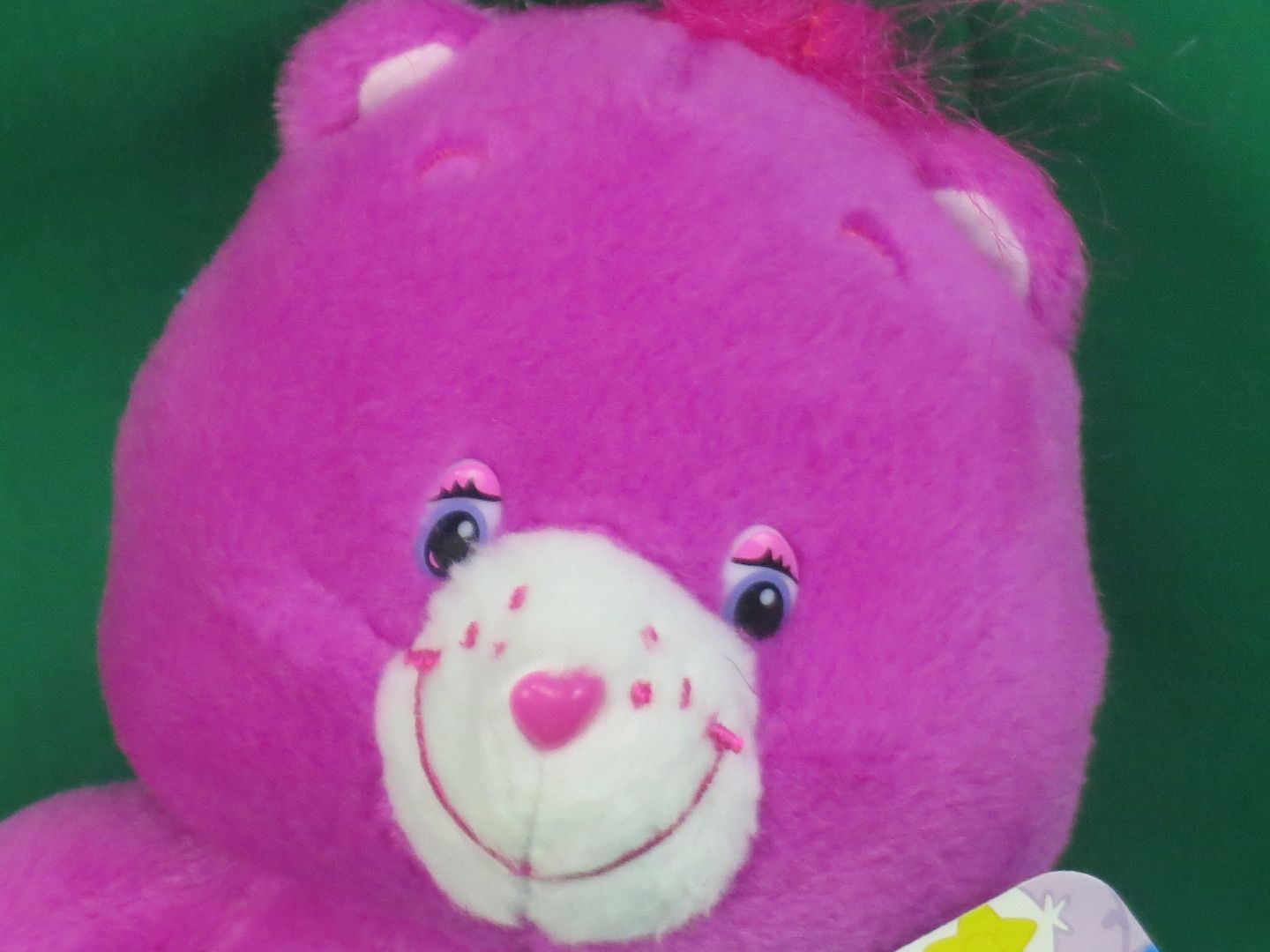 pink care bear with heart and sun