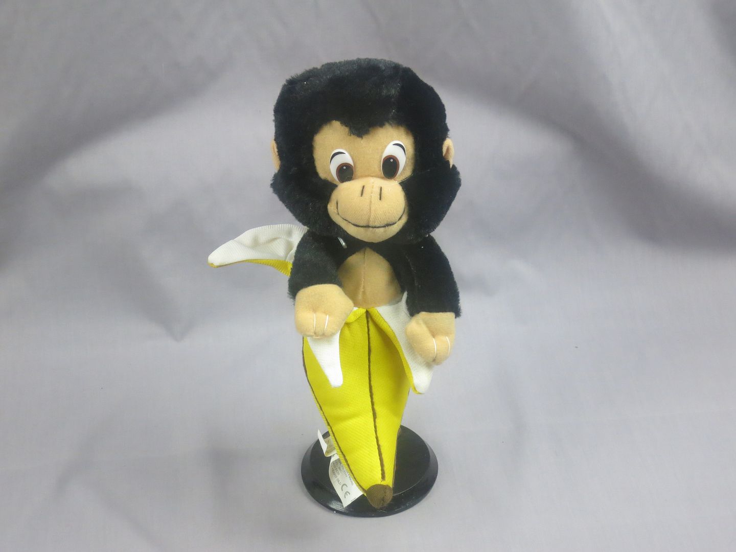 black brown monkey popping out of banana eat your fruits plush